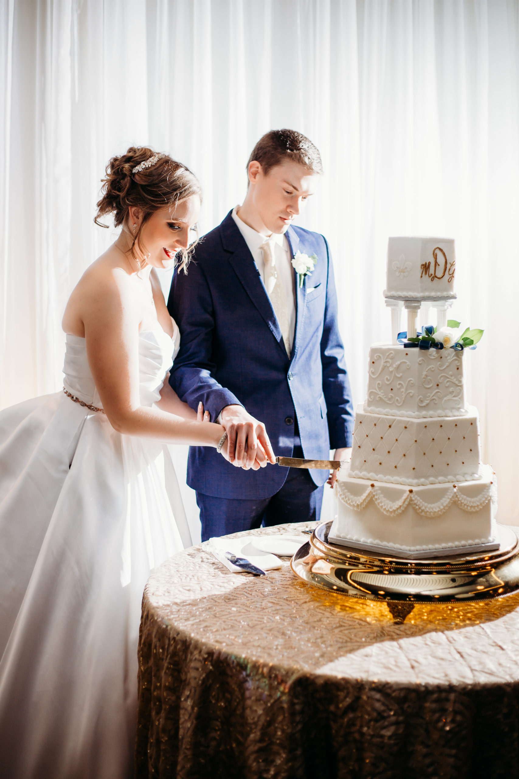 Photo of Couple that contacted and booked cutting their cake